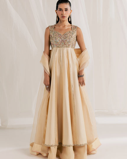 Model wearing Eraya Serene Aurora champagne peshwas lehnga with embellished yoke and organza dupatta