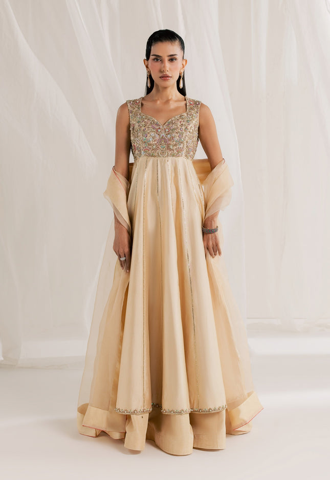 Model wearing Eraya Serene Aurora champagne peshwas lehnga with embellished yoke and organza dupatta