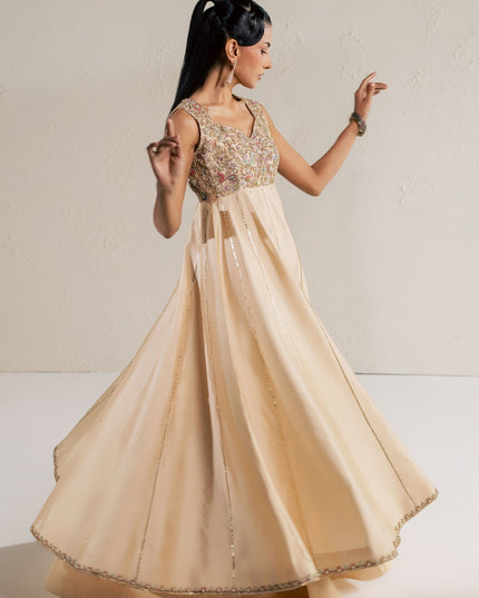 Eraya Serene Aurora champagne lehnga in motion showing the full flare and embellished hem border