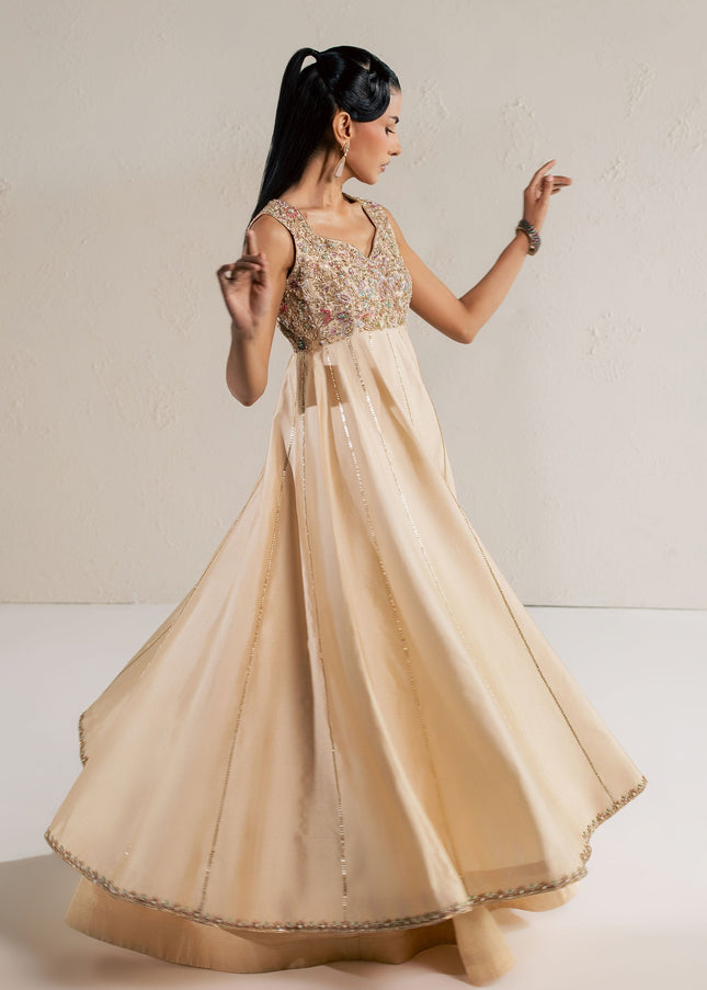Eraya Serene Aurora champagne lehnga in motion showing the full flare and embellished hem border