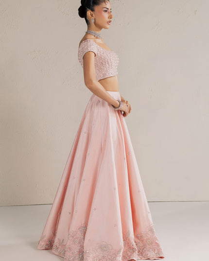 Side view of Eraya Serene Blossom blush pink lehnga choli showing the embellished floral hem border