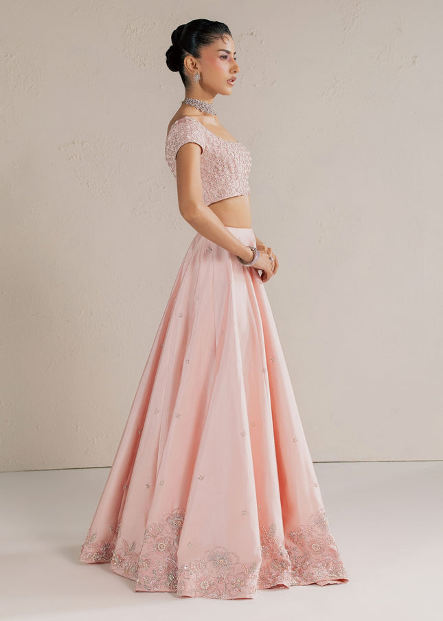 Side view of Eraya Serene Blossom blush pink lehnga choli showing the embellished floral hem border