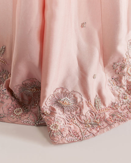 Detail of the embellished floral border on the Eraya Serene Blossom blush pink lehnga