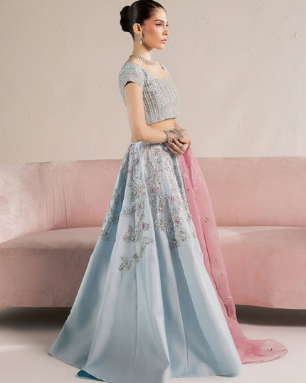 Model wearing Eraya Serene Camellia ice blue embellished lehnga choli with pink Mukesh organza dupatta