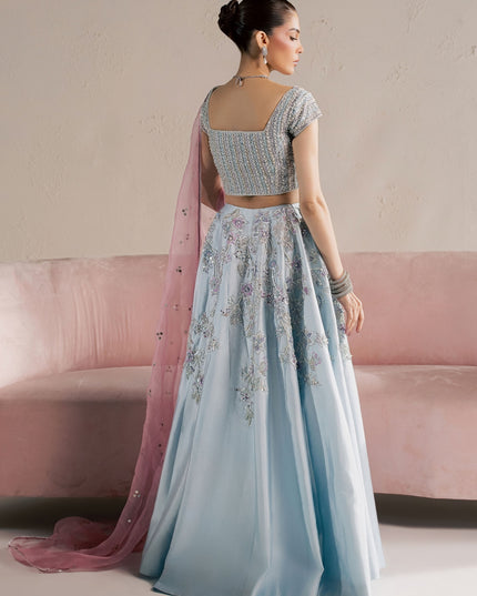Back view of Eraya Serene Camellia ice blue lehnga choli with pink organza dupatta