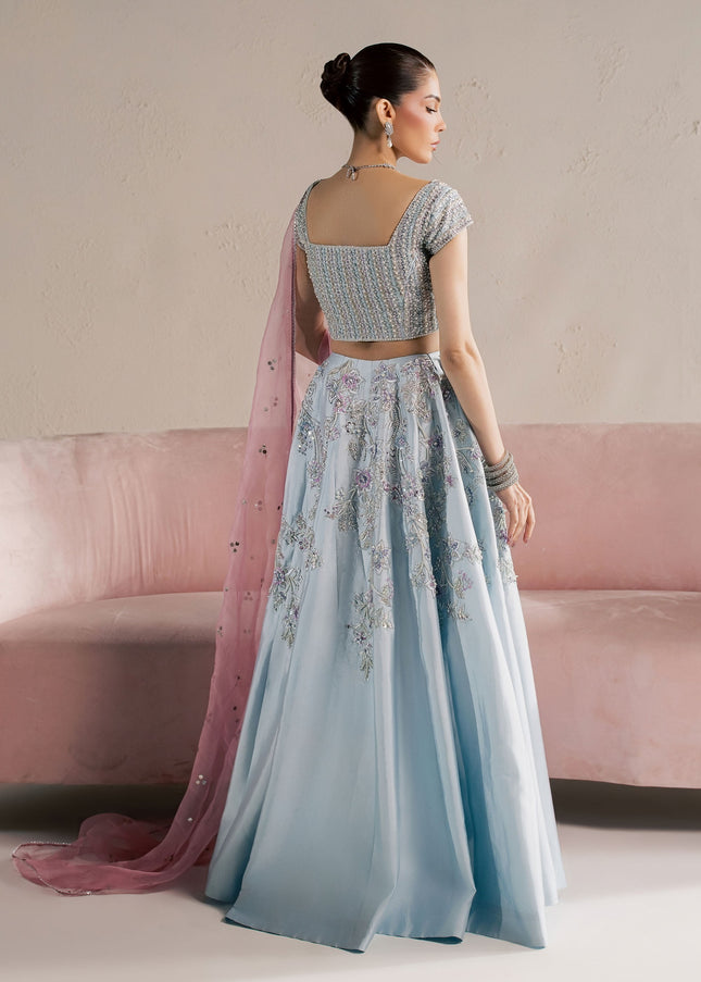 Back view of Eraya Serene Camellia ice blue lehnga choli with pink organza dupatta