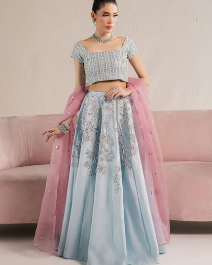Eraya Serene Camellia ice blue lehnga choli shown front on with pastel floral embellishment