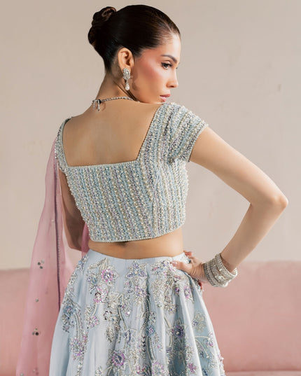 Close view of the embellished back choli on the Eraya Serene Camellia ice blue lehnga set