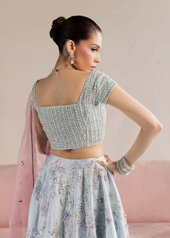 Close view of the embellished back choli on the Eraya Serene Camellia ice blue lehnga set