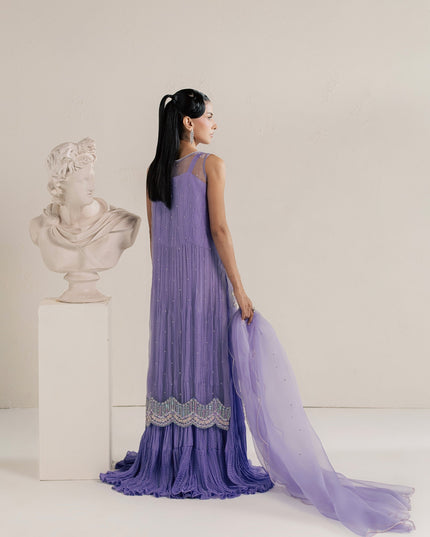 Eraya Serene Dahlia lilac ensemble from behind showing the flowing crushed silk gown and dupatta
