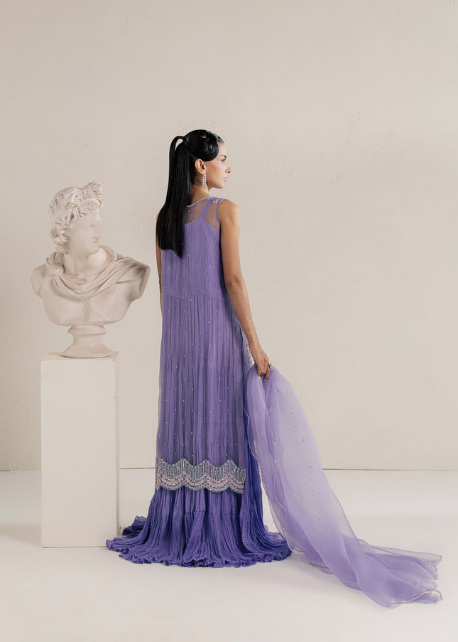 Eraya Serene Dahlia lilac ensemble from behind showing the flowing crushed silk gown and dupatta