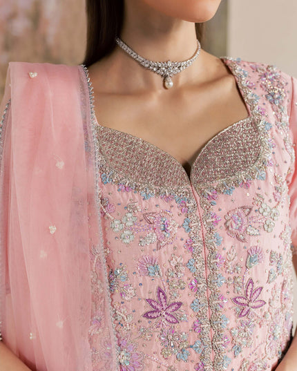 Macro detail of the embellished neckline on the Eraya Serene Flora pink shirt