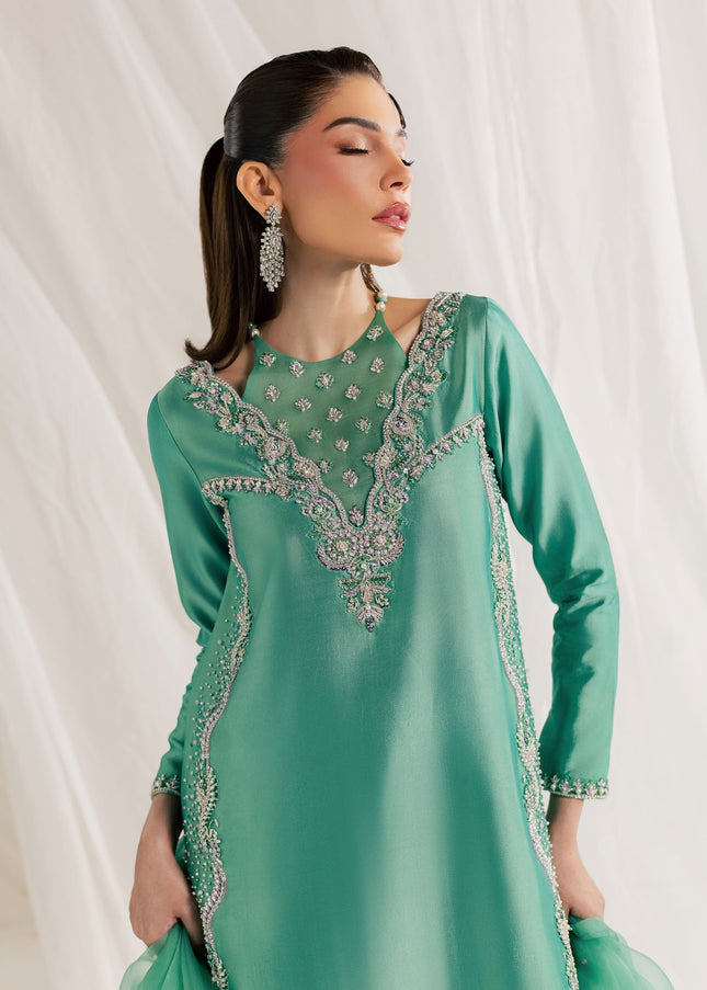 Eraya Serene Meadow mint green shirt showing embellished V neckline and scalloped hem detail