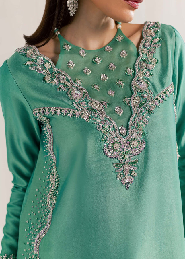 Close-up of the embellished V neckline on the Eraya Serene Meadow mint green shirt
