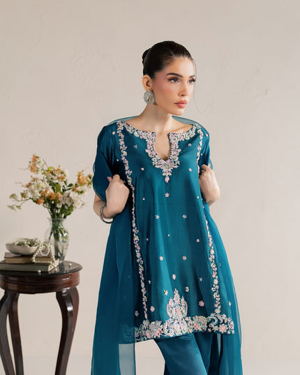 Model wearing Eraya Serene Opaline teal embellished peplum with tulip shalwar and organza dupatta