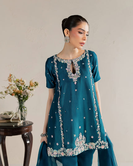 Eraya Serene Opaline teal peplum showing pastel sequin, pearl and crystal embellishment