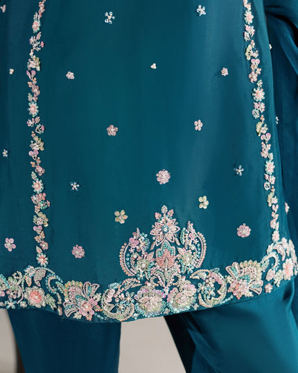 Detail of the embellished hem border on the Eraya Serene Opaline teal peplum