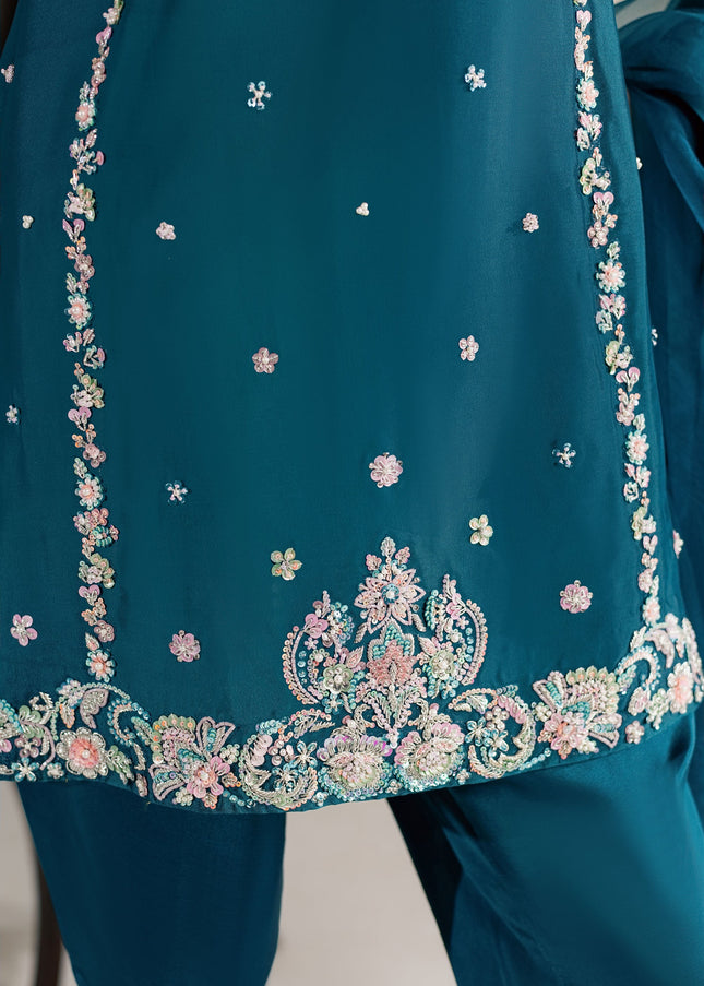 Detail of the embellished hem border on the Eraya Serene Opaline teal peplum