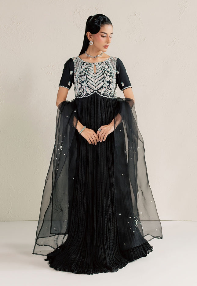 Model wearing Eraya Serene Raven black peshwas with embellished yoke and sheer organza dupatta