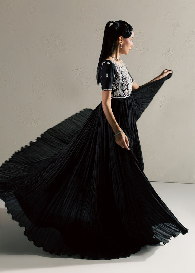 Eraya Serene Raven black peshwas in motion showing the flowing crushed silk flare