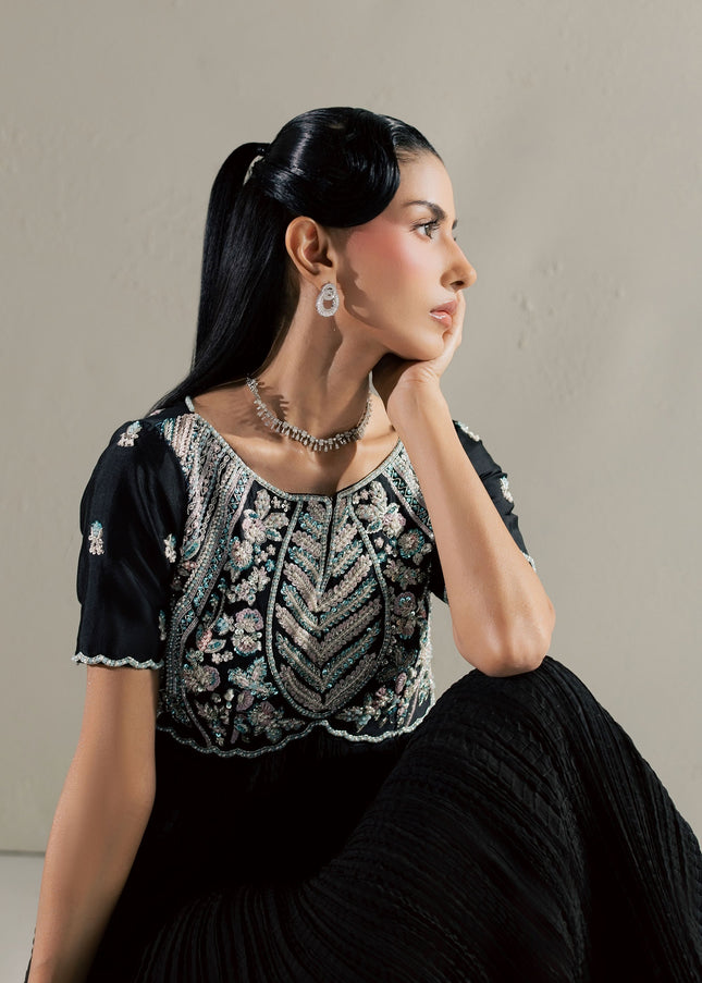 Seated close view of the Eraya Serene Raven black peshwas embellished bodice