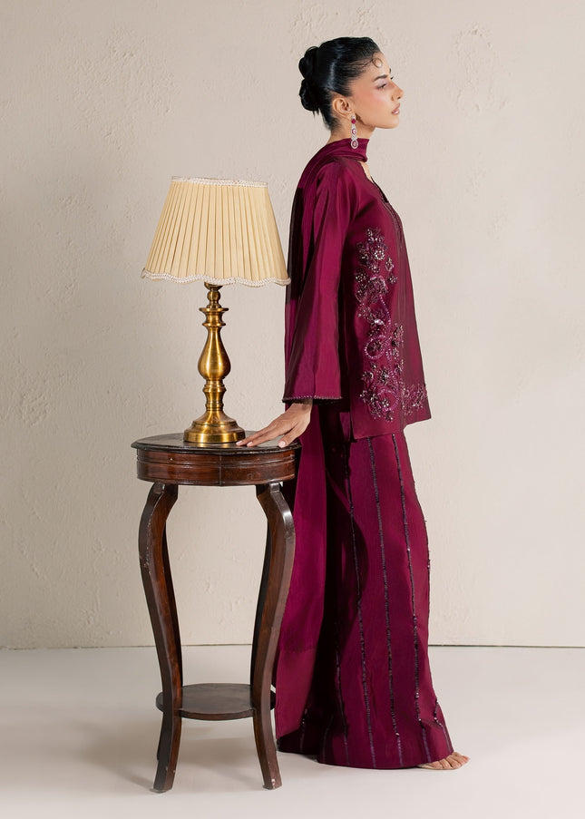 Side view of Eraya Serene Ruby wine outfit showing the sequin lines on the silk pants